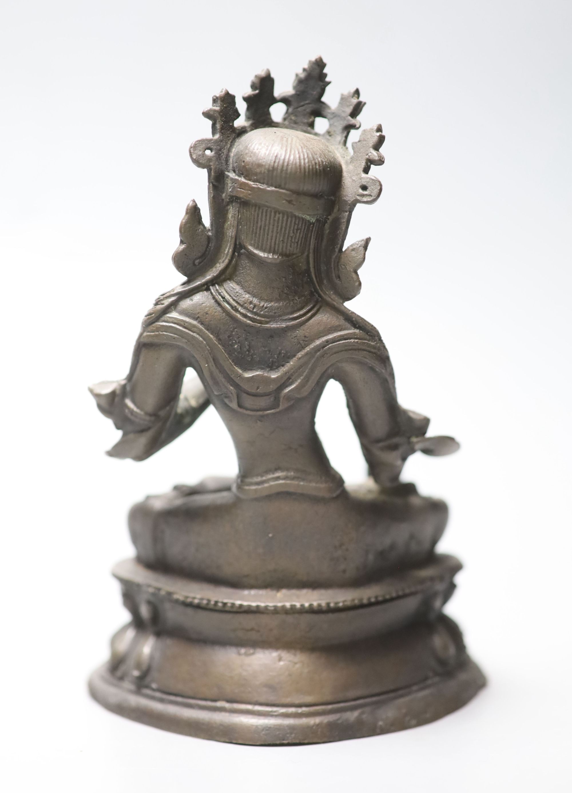 A Chinese or Sino-Tibetan bronze seated Buddha, possibly 18th century, height 16.5cm